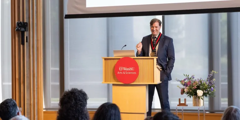 Brett D. Wick at the podium during his installation ceremony